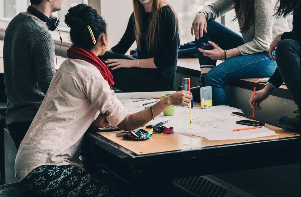 market research participants sharing opinions while sitting at a table
